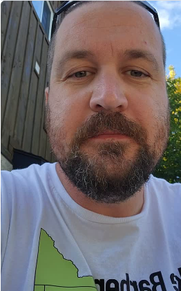 Mike Barber, candidate for Ward 2 on Guelph City Council, in his white Mike Barber campaign T-shirt